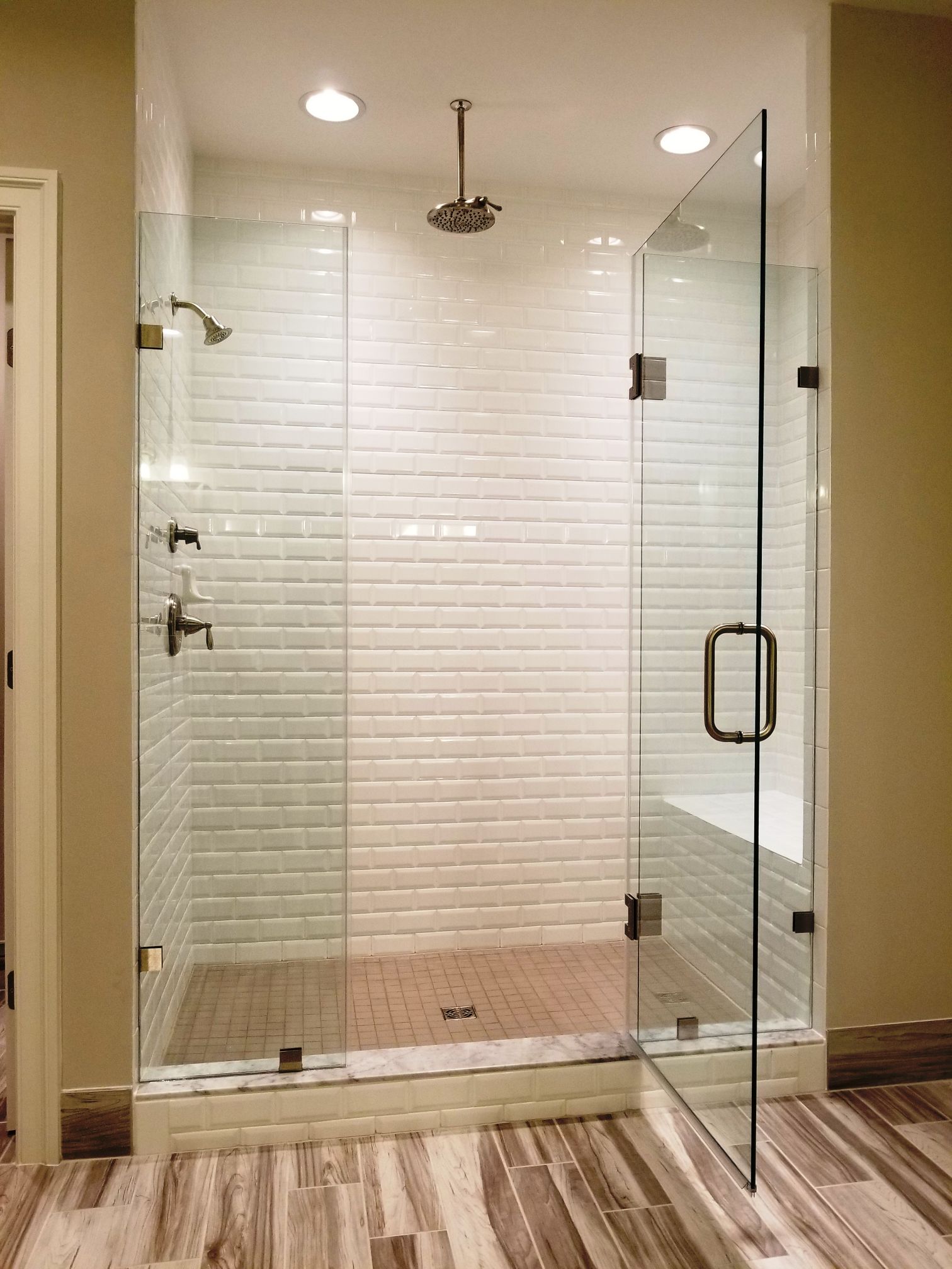 Framed shower door system.